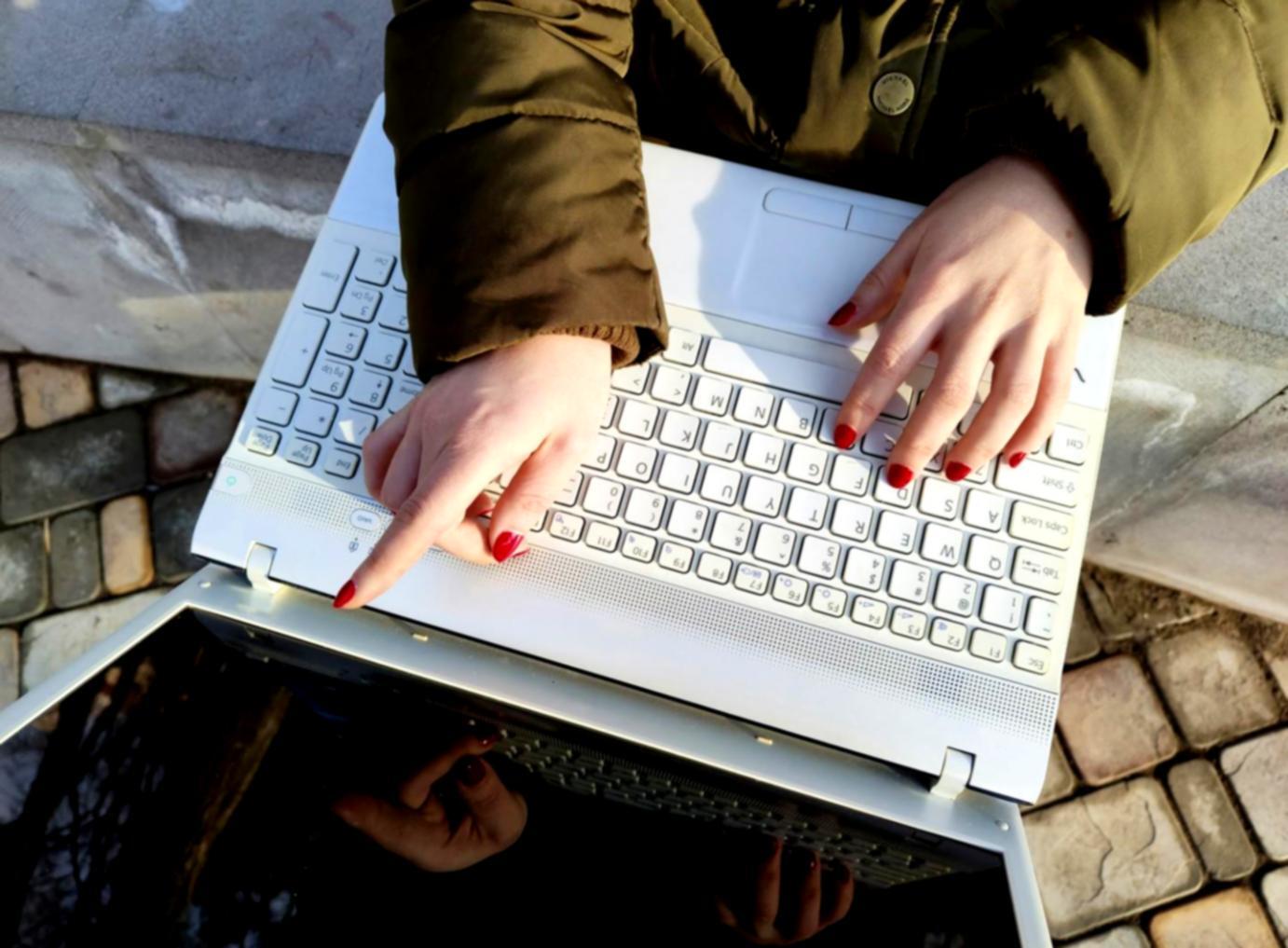 Professional analyst reviewing comprehensive budget trend charts and financial projections